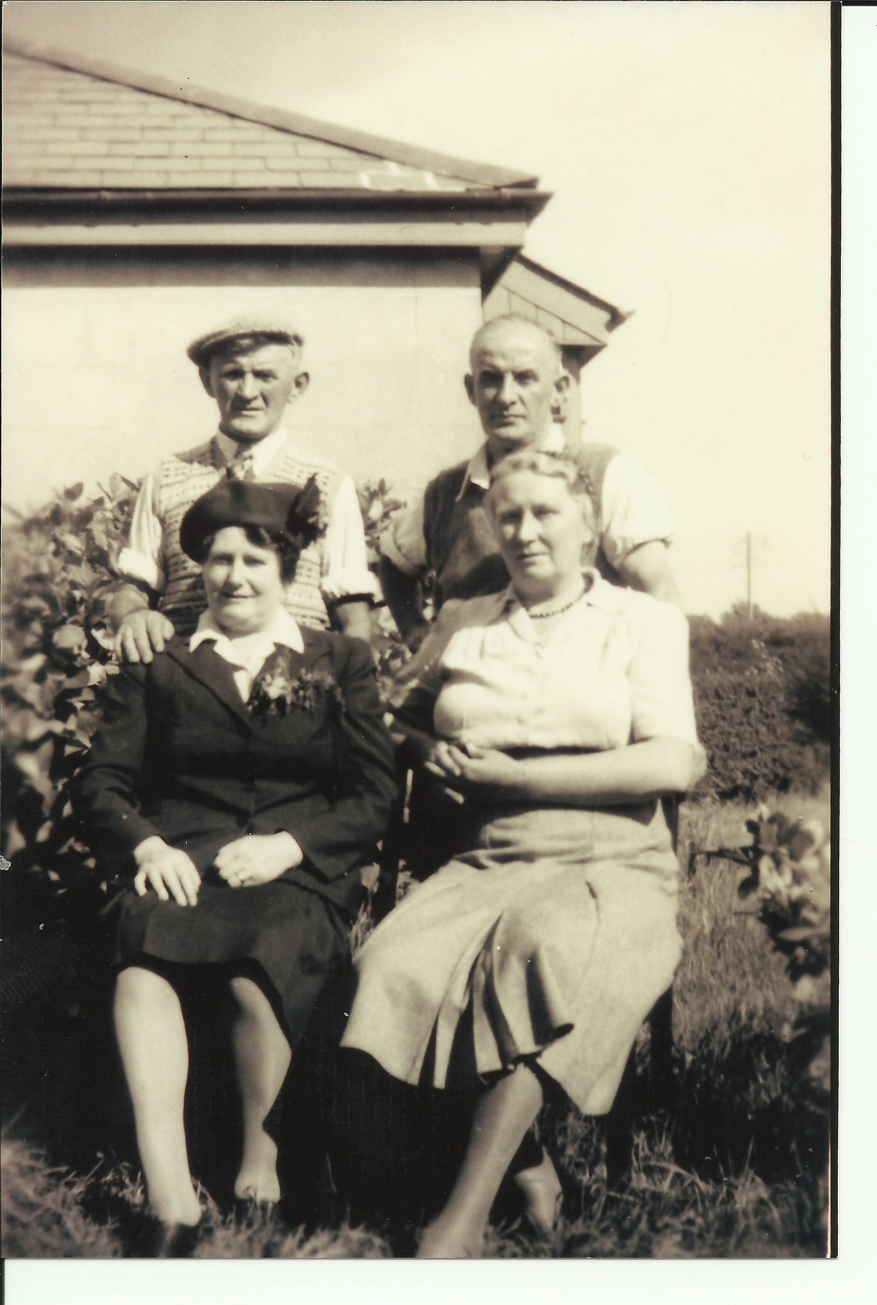 Photograph of Bob and Charlotte Renals with Jack Renals and Betsy Orchard on their fiftieth wedding anniversary, Tor View behind Bodmin Barracks
